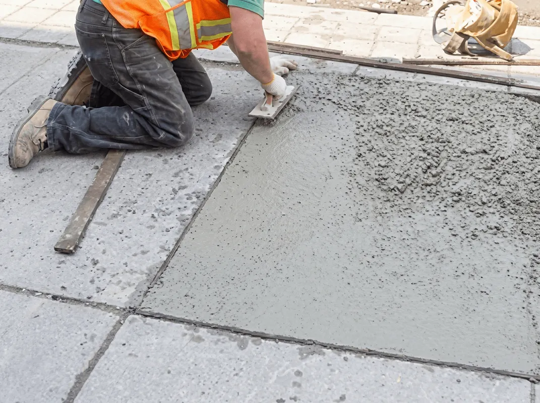 Professional repairing a concrete floor in Irvine, CA